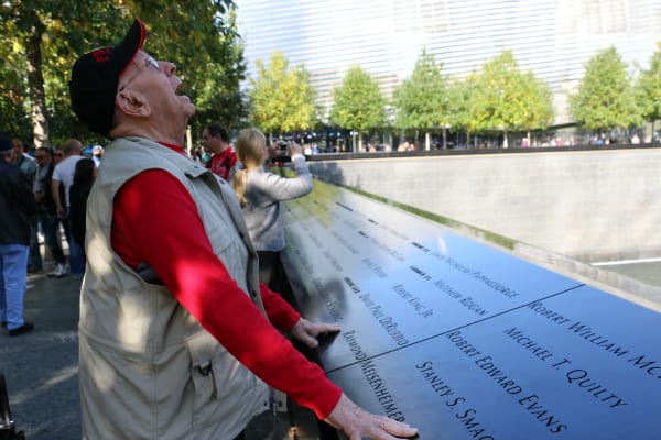 An older man looks at the 9-11 memorial