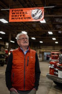 Wish recipient Earl stands inside the Four Wheel Drive Museum