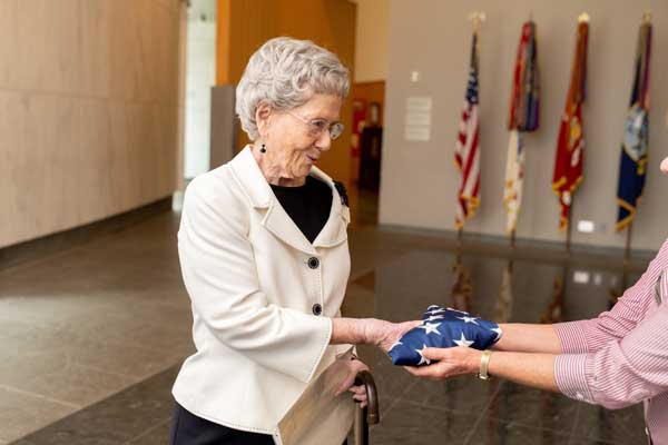Wish recipient Virginia receives an honorary American flag