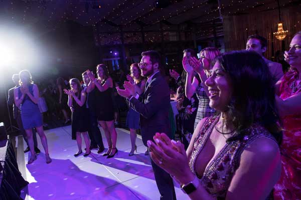Guests cheering and clapping at the WOL Annual Gala