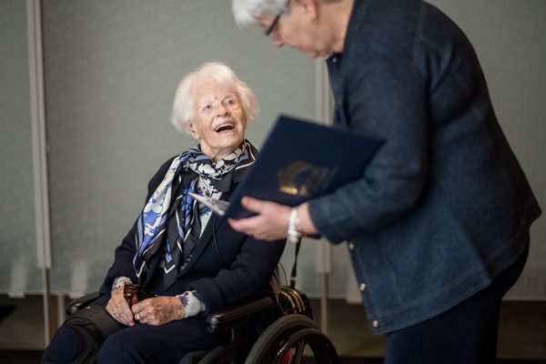 WWII Veteran Doris happily receiving her Living Legend award