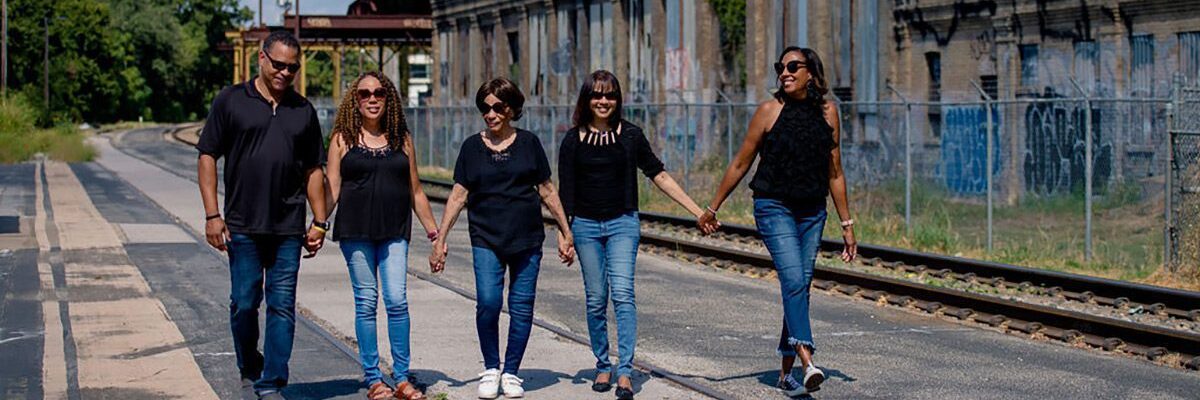 Louvenia and family walk across the train tracks after her wish
