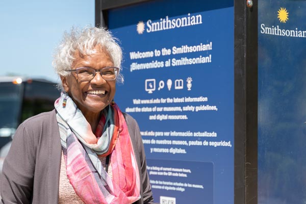 Carolyn beams before entering the Smithsonian National Museum of African American History and Culture