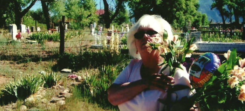 A woman carries flowers in the outdoors