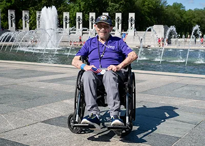 A Navy veteran sits in a wheelchair at the Veterans Memorial.