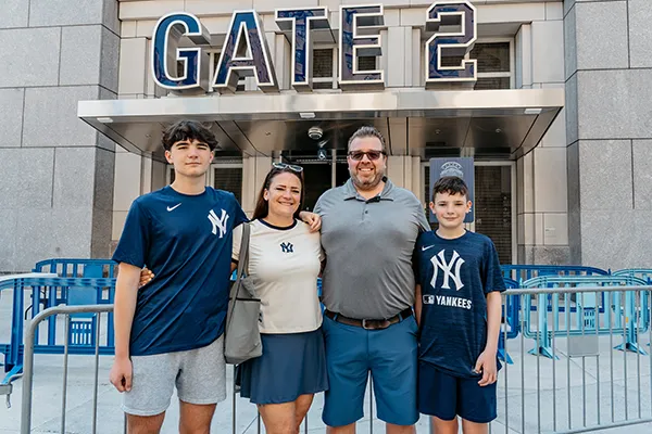 Family members stand together outside Yankee Stadium.