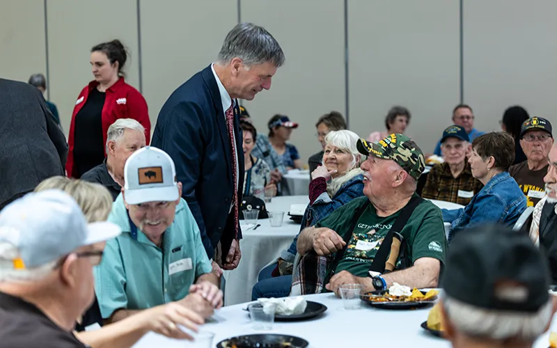 People talk at a luncheon