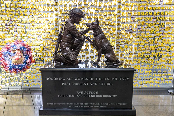 A statue of a soldier and a dog at the Military Womens Memorial