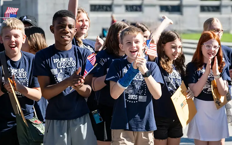 A group of children clapping