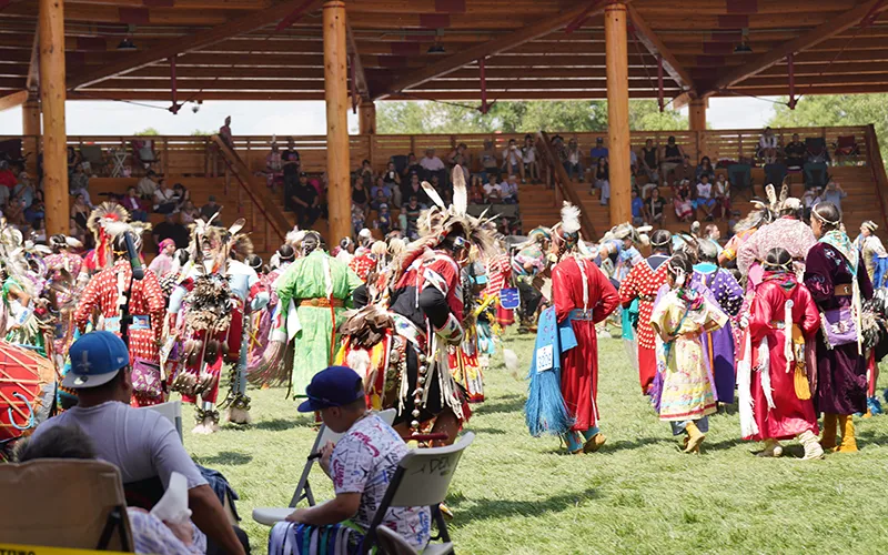 Native Americans wearing traditional clothing gather for the Crow Fair and Parade.